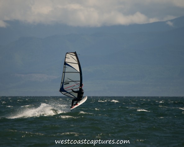 Lawrence doing a windsurf jump at Gordons